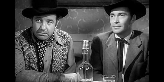 Broderick Crawford as WIlliam Morgan and Barry Sullivan as Tom Horn, talking about a job that could net them $100,000 in Bad Men of Tombstone (1949)