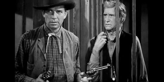 Bruce Cabot as Wild Bill, about to break Ned Nolan (Russell Simpson) out of jail in Wild Bill Hickok Rides (1942)