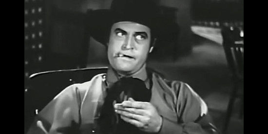 Chester Morris as Tom Cook, fed up with Hardtack's meddling in Wagons Westward (1940)