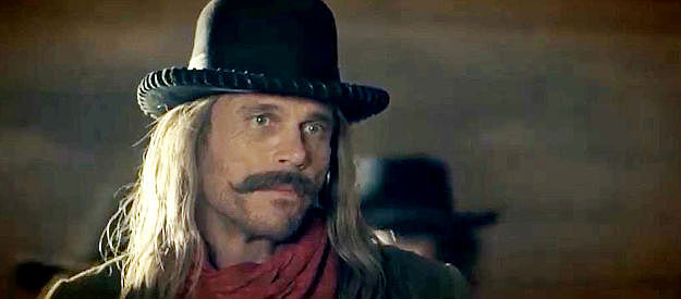 Chris Browning as Brett Clayton, the outlaw leader who killed Johnny Black's dad in Outlaw Johnny Black (2023)