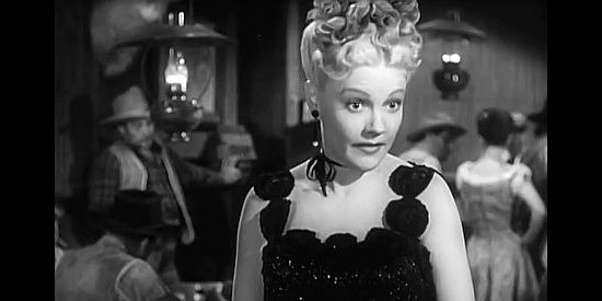 Claire Carleton as Nellie, the saloon girl who greets Tom Horn when he rides into Gold City in Bad Men of Tombstone (1949)