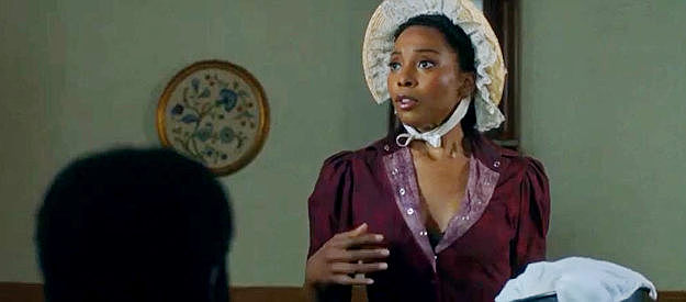 Erica Ash as Bessie Lee, delivering her hot buns to Johnny Black's room in Outlaw Johnny Black (2023)