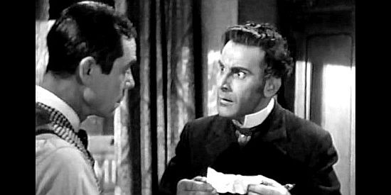 Fritz Field as Robert Oglethorpe, getting a threatening letter from Buckskin Bill in Shut My Big Mouth (1942)