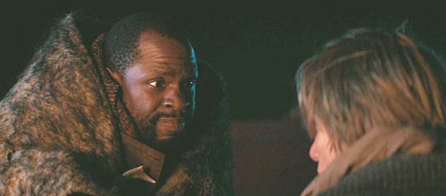 Gbenga Akinnagbe as Eutace Hollow, offering some advice to Jack Palmer as the trio hit the trail in The Thicket (2024)