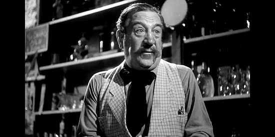 Hugh Herbert as Rocky Plummer, the Bella Union bartender who doubles as Deadwood's fire chief in Badlands of Dakota (1941)