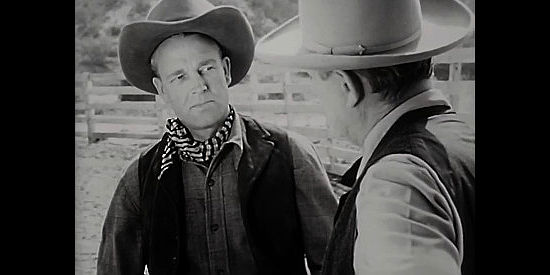 James Millican as Frank Keller, being quizzed about his gambling debt by Pop Marlowe in The Return of Wildfire (1948)