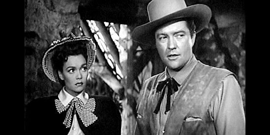 Jane Wyman as Ann Kincaid and Dennis Morgan as James Wylie, fearful their ruse is about to be discovered in Cheyenne (1947)