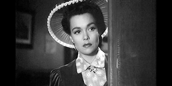 Jane Wyman as Ann Kincaid, unsure whether she can trust husband Ed Landers in Cheyenne (1947)