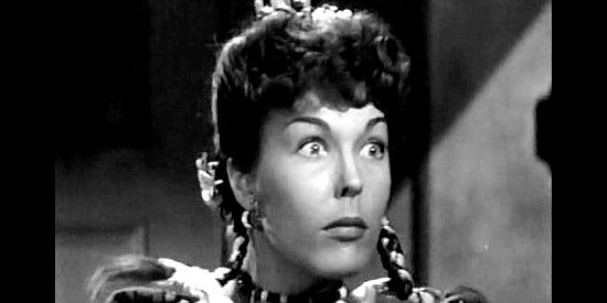 Joan Woodbury as Maria, trying to frighten Henrietta with the Romanian evil eye in Shut My Big Mouth (1942)