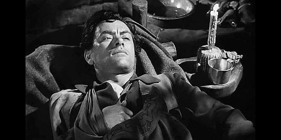 John Ireland as Bitter Creek, wounded and overhearing talk of being abandoned by the gang in The Doolins of Oklahoma (1949)