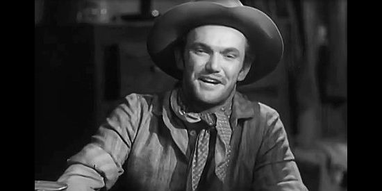 John Kellogg as Curly, daydreaming about what he's going to do once the gang splits up its loot in Bad Men of Tombstone (1949)