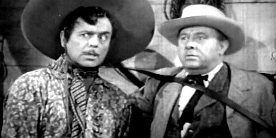 Leo Carrillo as Chinito Galvez, trying to scare answers out of a Ballard ally named Lindsay (Arthur Loft) in Frontier Badmen (1943)