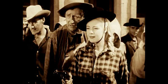 Mary Beth Hughes as Terry Williams and Olin Howland as Remedy, making sure a fight stays fair in Last of the Wild Horses (1948)