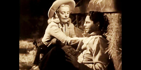 Mary Beth Hughes as Terry Williams, tending a wounded Duke Barnum (James Ellison) in Last of the Wild Horses (1948)