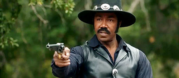 Michael Jai White as Johnny Black, ready to defend the good residents of Hope Springs in Outlaw Johnny Black (2023)