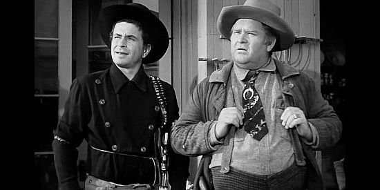 Noah Beery Jr. as Little Bill and Charles Kemper as 'Arkansas' Jones, marveling over Doolin's attempt to go straight in The Doolins of Oklahoma (1949)