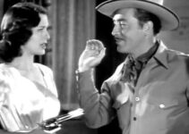 Ellen Drew as Ellen Dangerfield, with the man she thinks is Pecos Bill (John Howard) under her gun in Texas Rangers Ride Again (1940)