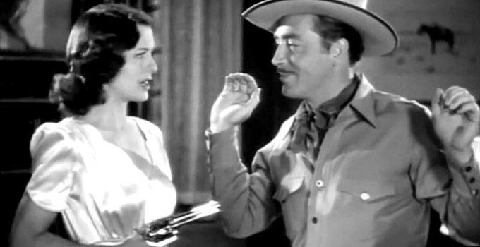 Ellen Drew as Ellen Dangerfield, with the man she thinks is Pecos Bill (John Howard) under her gun in Texas Rangers Ride Again (1940)