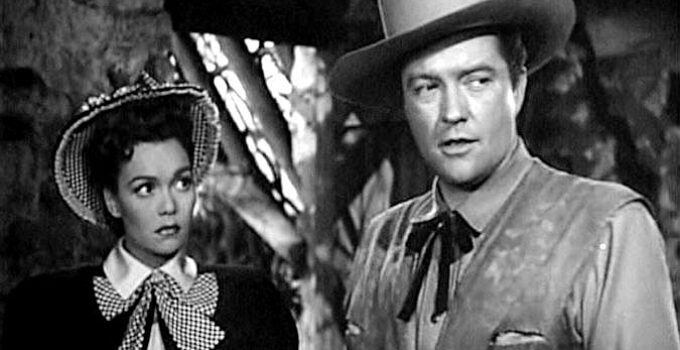 Jane Wyman as Ann Kincaid and Dennis Morgan as James Wylie, fearful their ruse is about to be discovered in Cheyenne (1947)