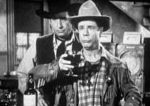 Joe E. Brown as Wellington Holmes, realizing his celebration of the demise of Buckskin Bill (Victor Jory) was a bit premature in Shut My Big Mouth (1942)