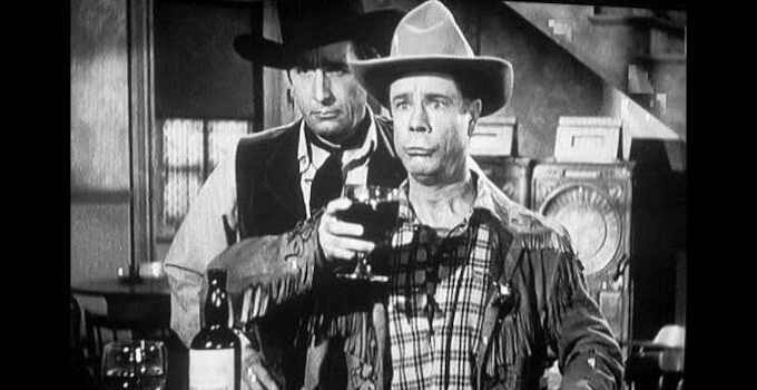 Joe E. Brown as Wellington Holmes, realizing his celebration of the demise of Buckskin Bill (Victor Jory) was a bit premature in Shut My Big Mouth (1942)