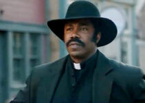 Michael Jai White as Johnny Black, ready to defend the residents of Hope Springs with Bible or six-guns in Outlaw Johnny Black (2023)