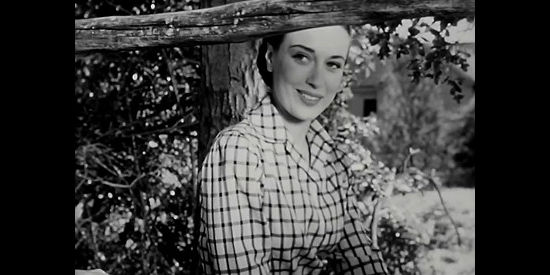 Patricia Morison as Pat Marlowe, getting to know the new ranch hand her dad has hired in The Return of Wildfire (1948)