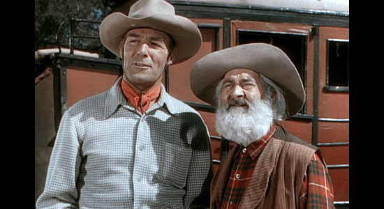 Randolph Scott as Cole Armin and 'Gabby' Hayes as Juke, arriving in town after an eventful stage ride in Albuquerque (1948)