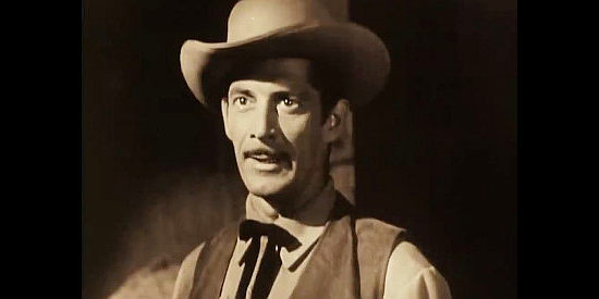 Reed Hadley as Riley Morgan, working for Charlie Cooper but looking out for himself in Last of the Wild Horses (1948)