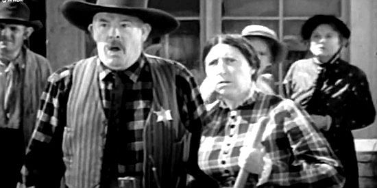 Robert Homans as the Abilene sheriff, reacting to a herd of cattle grazing in downtown Abilene in Frontier Badmen (1943)