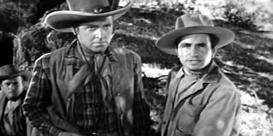 Robert Paige as Steve Logan and Noah Beery Jr. as Jim Cardwell, being ordered to move their herd in Frontier Badmen (1943)