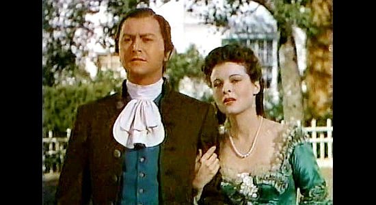 Robert Young as Langdon Towne with Elizabeth Browne (Ruth Hussey), the woman he dreams of returning home to in Northwest Passage (1940)