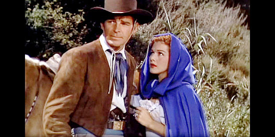 Rod Cameron as Capt. Phillip Kent and Maria Montez as Marguerita Navarro, being taken captive in Pirates of Monterey (1947)