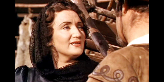 Tamara Shayne as FIlomena, Marguerita's assistant, flirting with Sgt. Pio in Pirates of Monterey (1947)