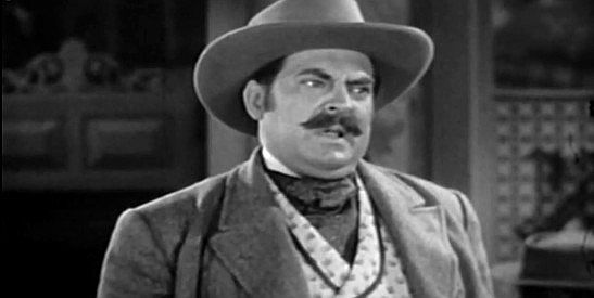 Thomas Gomez as Ballard, the saloon owner controlling the cattle marker in Abilene in Frontier Badmen (1943)