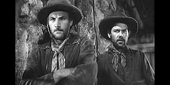 Two gang members ready for a showdown with the man who says he's The Poet in Cheyenne (1947)