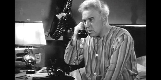 William Duncan as Texas Ranger Capt. Inglis, taking an urgent late-night phone call in Texas Rangers Ride Again (1940)