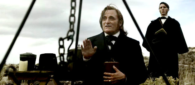 Kim Coates as Brigham Young, speaking to his flock about past injustices in American Primeval (2025)