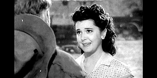 Ann Rutherford as Lucy Kincaid, thanking Reb Harkness for all of his help in Wyoming (1940)