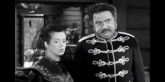 Elsa Lanchester as Princess Tatiana and Hugo Hass as Prince Nickolai Balinin, waiting for their new guest to arrive in Northwest Outpost (1947)