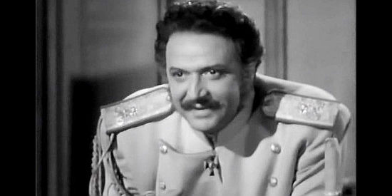 Hugo Hass as Prince Nickolai Balinin, enchanted by Natalia's beauty and voice in Northwest Outpost (1947)