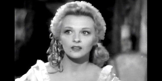 Ilona Massey as Natalia Alanova, arriving at Fort Ross with a mission only her maid is aware of in Northwest Outpost (1947)