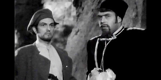 Joseph Schildkraut as Count Igor Savin and Peter Whitney as Fort Ross guard Volkoff, watching to see if they're being trailed in Northwest Outpost (1947)