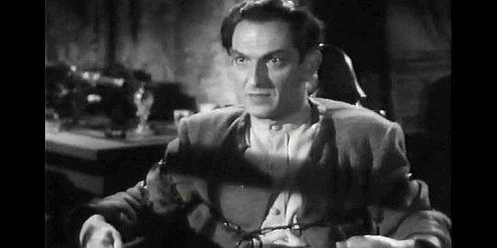 Joseph Schildkraut as Count Igor Savin, demanding that Natalia help him escape to spare her father's life in Northwest Outpost (1947)