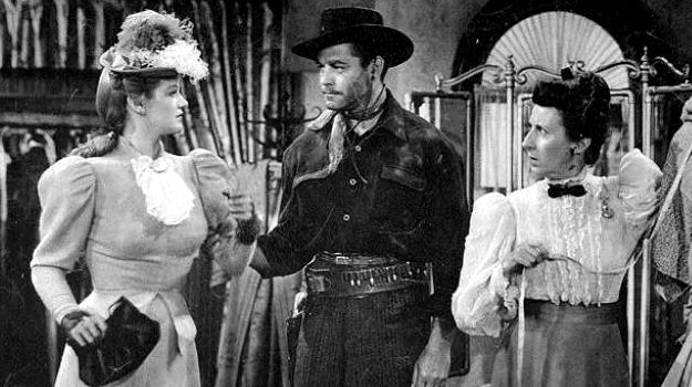 Martha O'Driscoll as Mary Bohannon and Alan Curtis as Emmett Dalton, at odds over a mud-splattered dress in The Daltons Ride Again (1945)