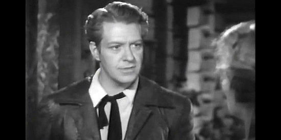 Nelson Eddy as Capt. Jim Laurence, learning Igor Savin has escaped Fort Ross in Northwest Outpost (1947)