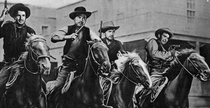 The Dalton boys -- Noah Beery Jr. as Ben, Kent Taylor as Bob, Alan Curtis as Emmett and Lon Chaney Jr. as Grat -- charge through Skeleton Creek in The Daltons Ride Again (1945)