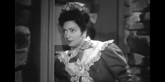 Tamara Shayne as Olga, Natalia's maid, seeing what she can learn by eavesdropping in Northwest Outpost (1947)