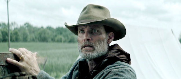 Casper Van Dien as Luke, wondering how to rescue a young girl from a camp filled with Union soldiers in Guns of Redemption (2025)
