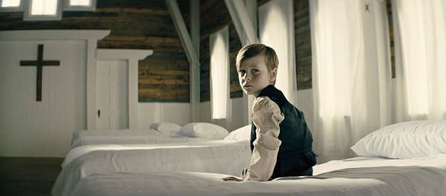 Easton Malcolm as Jacob Hollister, left alone after his older brother is convicted of murder in Rust (2004)